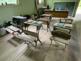 Interior of old school Desks and books inside the school of Alice Arm #olafincanada #britishcolumbia #discoverbc #abandonedbc #alicearm #school